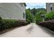 Private driveway leading to a home, surrounded by lush landscaping and mature trees at 647 East Ne Ave, Atlanta, GA 30312