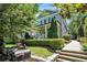 Charming two-story home with a welcoming front porch and professionally landscaped front yard with a defined walkway at 647 East Ne Ave, Atlanta, GA 30312