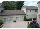 Charming home exterior featuring a multi-car garage, a well-maintained yard, and professional landscaping at 647 East Ne Ave, Atlanta, GA 30312