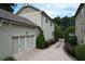 Home with attached oversized garage and a long private driveway, perfect for parking and storage at 647 East Ne Ave, Atlanta, GA 30312
