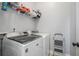 Well-equipped laundry room featuring a modern washer and dryer and ample storage space at 647 East Ne Ave, Atlanta, GA 30312