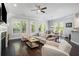 Bright living room with hardwood floors, a dining area, and comfortable seating with ample natural light at 647 East Ne Ave, Atlanta, GA 30312