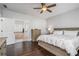 Comfortable main bedroom with hardwood floors and ensuite bathroom at 647 East Ne Ave, Atlanta, GA 30312