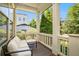 Relaxing porch with a cozy seating area, complemented by views of lush greenery and a bright, open atmosphere at 647 East Ne Ave, Atlanta, GA 30312