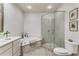 Bathroom featuring a glass enclosed shower, soaking tub, and double vanity at 1717 N Decatur Ne Rd # 214, Atlanta, GA 30307