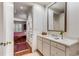 Bathroom with white vanity and view into bedroom with closet and natural light at 1717 N Decatur Ne Rd # 214, Atlanta, GA 30307