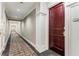 Well-maintained hallway with neutral paint, carpet, trim work, and recessed lighting leading to unit 214 at 1717 N Decatur Ne Rd # 214, Atlanta, GA 30307
