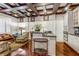 Gourmet kitchen with stainless steel appliances, granite countertops, and adjacent cozy living area at 1717 N Decatur Ne Rd # 214, Atlanta, GA 30307