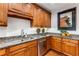 Kitchen featuring hardwood floors, granite counters, stainless appliances and wood cabinets at 1717 N Decatur Ne Rd # 214, Atlanta, GA 30307