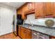 Kitchen featuring a stainless steel refrigerator, dishwasher, sink, and granite counters at 1717 N Decatur Ne Rd # 214, Atlanta, GA 30307