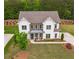 Aerial shot of a beautifully landscaped home with a well-manicured lawn at 2360 Charleston Manor Ln, Suwanee, GA 30024