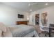 Bedroom with a desk, study area, large windows, ceiling fan, and access to a walk-in closet at 2360 Charleston Manor Ln, Suwanee, GA 30024