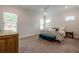 Spacious bedroom with natural light, plush carpeting, and comfortable furnishings at 2360 Charleston Manor Ln, Suwanee, GA 30024