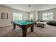 Game room featuring a pool table, comfortable seating, large windows, and natural light at 2360 Charleston Manor Ln, Suwanee, GA 30024