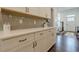 Kitchen features modern cabinets, stainless steel appliances, and hardwood floors at 2360 Charleston Manor Ln, Suwanee, GA 30024