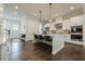 Spacious kitchen with a large island, stainless steel appliances, and modern white cabinetry at 2360 Charleston Manor Ln, Suwanee, GA 30024