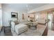 Open-concept living room with hardwood floors, neutral tones, and ample natural light at 2360 Charleston Manor Ln, Suwanee, GA 30024