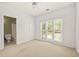 Spacious bedroom featuring a window and an adjoining bathroom at 3187 Gainer Dr, Powder Springs, GA 30127