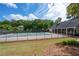Community pool area featuring a large swimming pool, shaded seating, and well-maintained landscaping at 3187 Gainer Dr, Powder Springs, GA 30127