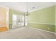 Cozy dining room features wainscoting, carpet, and large windows at 3187 Gainer Dr, Powder Springs, GA 30127
