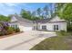 Charming single-story home featuring a two-car garage and a well-manicured front yard and lovely blue shutters at 3187 Gainer Dr, Powder Springs, GA 30127