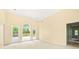 Sunlit living room with large windows provides serene backyard views at 3187 Gainer Dr, Powder Springs, GA 30127