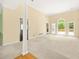 Bright living room features high ceilings and large windows with backyard views at 3187 Gainer Dr, Powder Springs, GA 30127