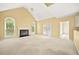 Spacious living room with fireplace, high ceilings, and natural light at 3187 Gainer Dr, Powder Springs, GA 30127
