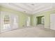 Large bedroom featuring double doors to the backyard and an en-suite bathroom at 3187 Gainer Dr, Powder Springs, GA 30127