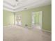 Spacious main bedroom with carpet, doors to the outside, and attached bathroom at 3187 Gainer Dr, Powder Springs, GA 30127