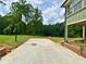 Backyard with a basketball hoop, a concrete pad, and a view of the pond at 3340 Zingara Rd, Conyers, GA 30012
