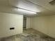 Unfinished basement with concrete floor, neutral painted walls, and lots of potential for upgrades at 3340 Zingara Rd, Conyers, GA 30012