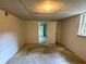 Unfinished basement with concrete floor, neutral painted walls, and lots of potential for upgrades at 3340 Zingara Rd, Conyers, GA 30012