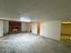 Large unfinished basement with a brick fireplace, neutral paint, and lots of potential for upgrades at 3340 Zingara Rd, Conyers, GA 30012