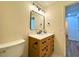 Bathroom vanity with a marble countertop and modern fixtures at 3340 Zingara Rd, Conyers, GA 30012