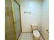 Tidy bathroom featuring a frosted glass shower and a standard toilet at 3340 Zingara Rd, Conyers, GA 30012