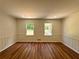 Bedroom with hardwood flooring, neutral paint, and ample natural light from the window at 3340 Zingara Rd, Conyers, GA 30012
