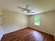 Comfortable bedroom featuring hardwood floors, natural light from window, and neutral paint at 3340 Zingara Rd, Conyers, GA 30012