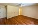 This bedroom offers hardwood floors, a ceiling fan and neutral colored walls at 3340 Zingara Rd, Conyers, GA 30012