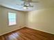 Simple bedroom featuring hardwood floors and a ceiling fan at 3340 Zingara Rd, Conyers, GA 30012