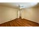 Bedroom with hardwood floors, ceiling fan, and closet at 3340 Zingara Rd, Conyers, GA 30012
