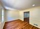 Dining area showcasing hardwood floors, wainscoting, and a window overlooking the landscape at 3340 Zingara Rd, Conyers, GA 30012