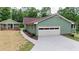 Charming home with a large garage and a well-maintained lawn, showcasing inviting curb appeal at 3340 Zingara Rd, Conyers, GA 30012