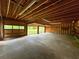 Spacious three-car garage with overhead lighting and concrete flooring at 3340 Zingara Rd, Conyers, GA 30012