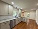 This kitchen offers gray cabinets, granite countertops and stainless steel appliances at 3340 Zingara Rd, Conyers, GA 30012