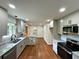 This kitchen offers gray cabinets, granite countertops and stainless steel appliances at 3340 Zingara Rd, Conyers, GA 30012