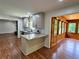 This renovated kitchen features an island with granite counters and stainless appliances at 3340 Zingara Rd, Conyers, GA 30012