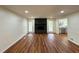 Spacious living room boasts a stone fireplace, hardwood floors, and abundant natural light at 3340 Zingara Rd, Conyers, GA 30012