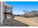 Expansive backyard with a view of the screened-in porch, stairs, and neighboring houses at 496 Spring View Dr, Woodstock, GA 30188