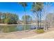 Scenic view of lake, gazebo and trees at 496 Spring View Dr, Woodstock, GA 30188